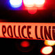 Police tape cordons off a crime scene.
